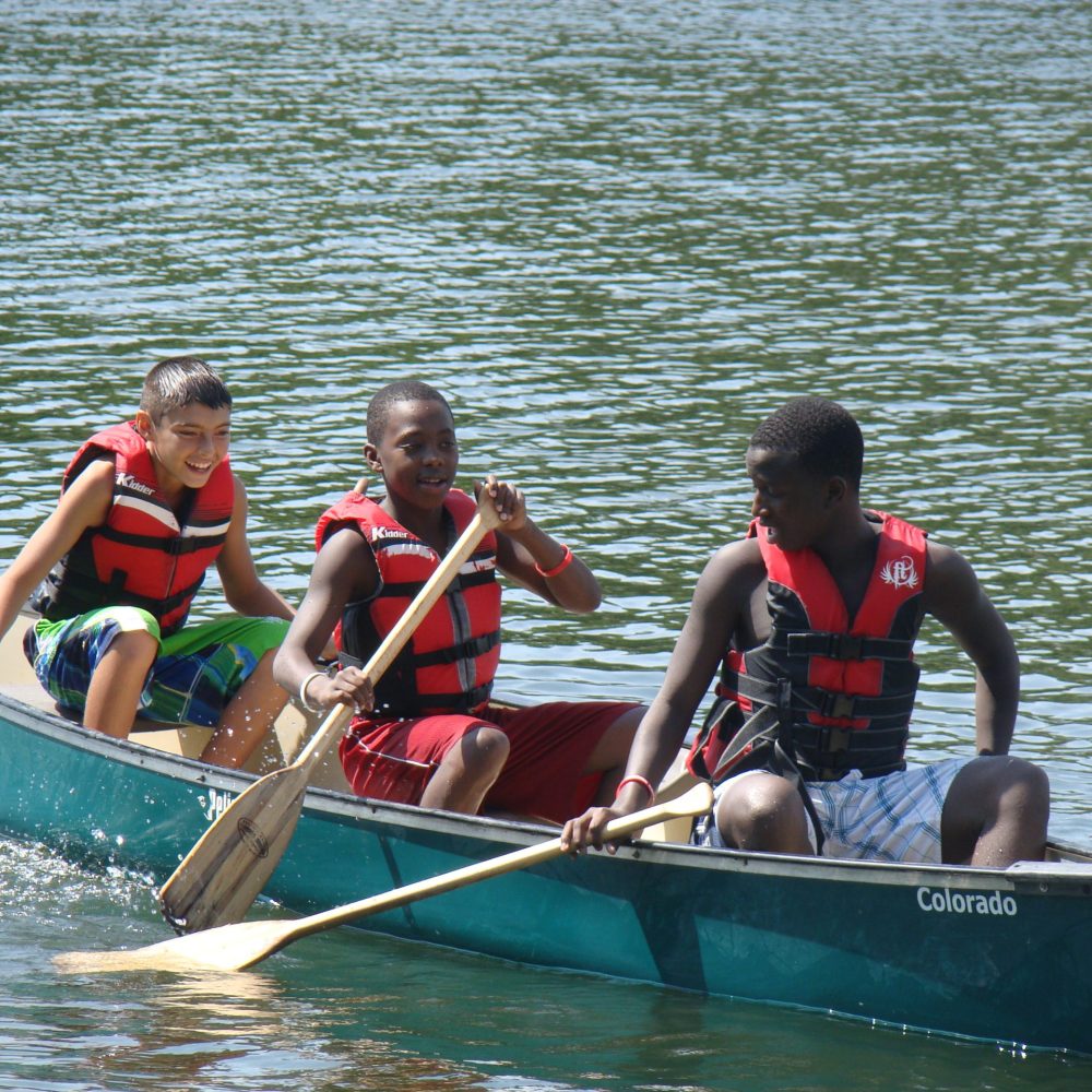 canoe three boys side view