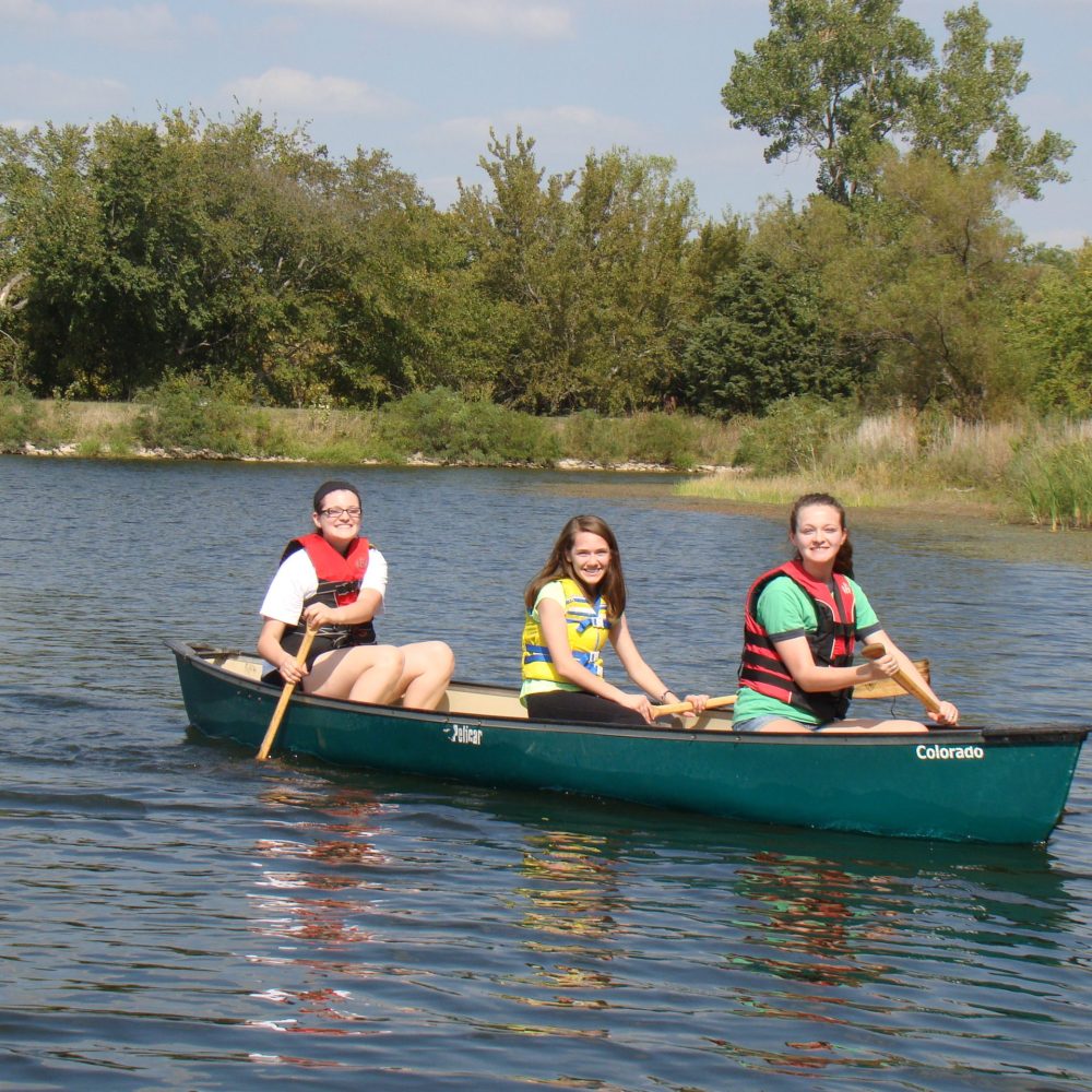 canoe, three girls side view